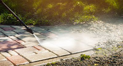 Pressure washing a driveway